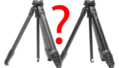 Two carbon fiber tripods shown side-by-side with a red question mark between them, suggesting a comparison or choice.