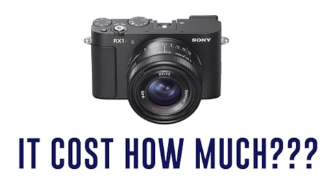 Sony RX1 compact camera with prime lens displayed against white background.