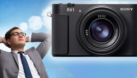 Sony RX1R compact camera with Zeiss lens displayed against split composition of businessman and sky.