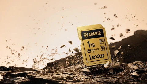 Lexar Armor 1TB SD card positioned on splashing water with particles suspended in air.