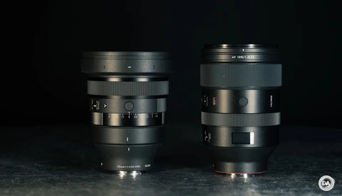 Two vintage camera lenses displayed side by side against a dark background.