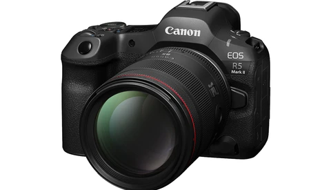 Canon EOS R5 Mark II mirrorless camera with attached telephoto lens against white background.
