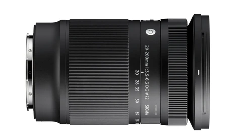 Sigma telephoto zoom lens with ribbed barrel and focus ring against white background.