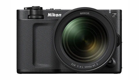 Nikon Z mirrorless camera with attached Nikkor zoom lens, shown from front against white background.