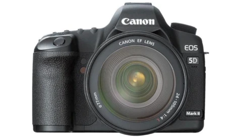 Canon EOS 5D Mark II DSLR camera with kit lens attached, shown from front three-quarter angle.