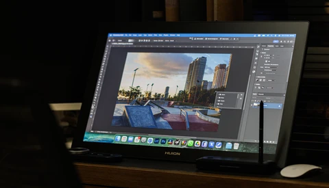 Screenshot of photo editing software displaying an architectural cityscape image with waterfront boats during post-processing.