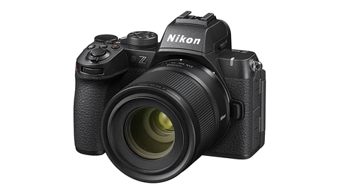 Nikon Z mirrorless camera with standard zoom lens mounted, shown at three-quarter angle against white background.