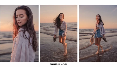 Woman in light blue shirt running through shallow ocean water at golden hour sunset.