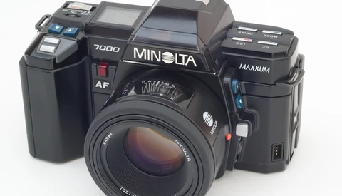 Three Minolta film cameras displayed side by side against a white background.