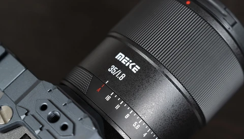 Meike 85mm f/1.8 lens mounted on a camera body, showing the lens barrel and focus ring in detail.