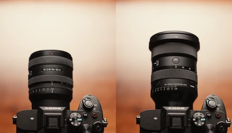 Two mirrorless cameras with different zoom lenses mounted, displayed against a warm gradient background.