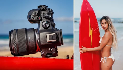 Canon EOS R5 camera with RF lens mounted on red fabric against a beach and ocean backdrop.