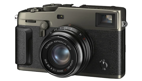 Fujifilm X-Pro1 rangefinder camera with champagne and black finish, showing fixed prime lens and optical viewfinder.
