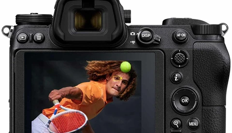 Nikon mirrorless camera with rear LCD screen displaying food photography of a person with produce.