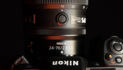 Nikkor 24-70/2.8 S II lens mounted on a camera body, showing the zoom ring and focal length markings.