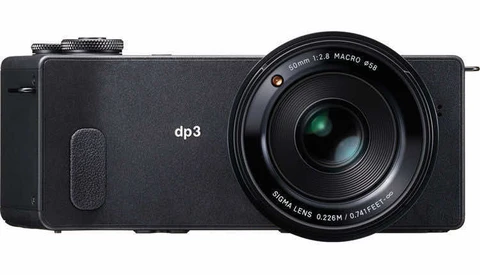 Sigma dp3 Merrill compact camera with fixed prime lens, shown from the right side against a white background.