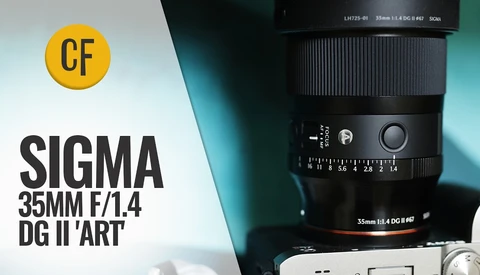 Sigma 35mm f/1.4 DG II Art lens mounted on camera body against teal background.