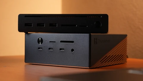 Compact desktop docking station with multiple USB ports and card readers, stacked with a black control panel on top.