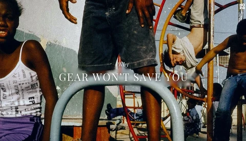 Group of people gathered around playground equipment with overlaid text reading 'GEAR WON'T SAVE YOU.'
