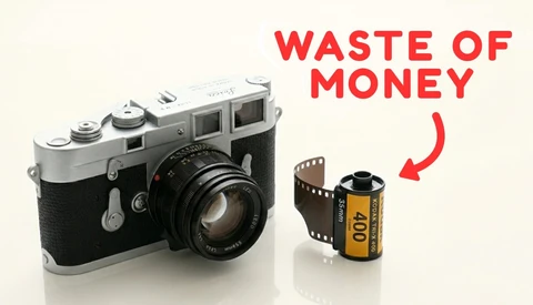 Vintage rangefinder camera next to a roll of film with red text reading "Waste of Money."
