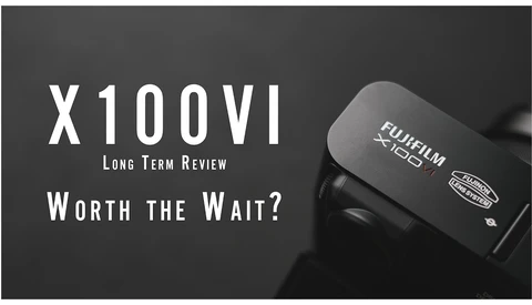 Fujifilm X100VI camera displayed against dark background with text overlay reading "X100VI Long Term Review Worth the Wait?"