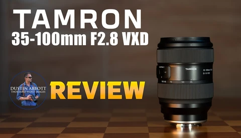 Tamron 35-100mm F2.8 VXD lens displayed on checkered surface with review title graphic.