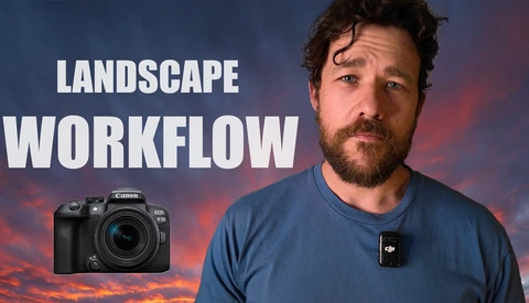 Man in blue shirt standing before dramatic sunset sky with Canon camera and DJI drone displayed.