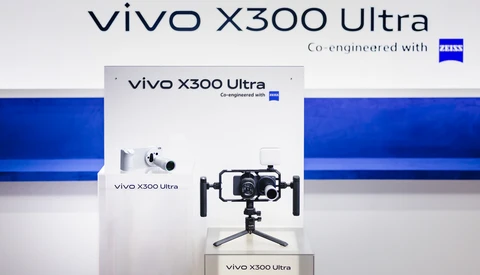 Vivo X300 Ultra smartphone mounted on a tripod rig with stabilization arms, displayed at a product launch event.