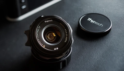 Tthpooh wide-angle lens with front cap on dark textured surface