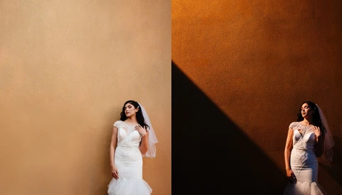 Bride in white mermaid wedding dress posing against split-tone backdrop with warm tan and deep orange walls