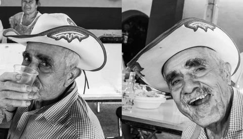 Two elderly men wearing cowboy hats in a black and white portrait photograph