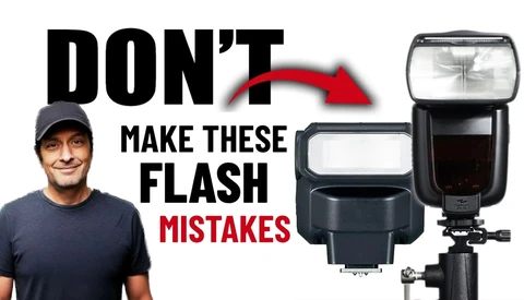 Instructor in casual attire pointing to three external camera flash units displayed against white background.