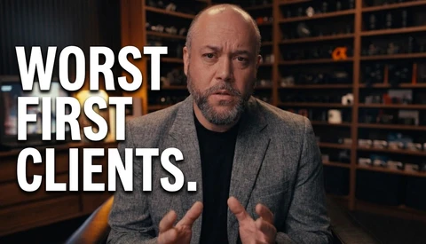 Man in gray blazer speaking directly to camera with hands gesturing, with text overlay reading "WORST FIRST CLIENTS."
