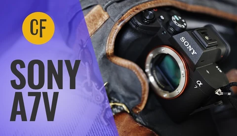 Sony A7V camera body held in brown leather camera strap against purple background with CF logo.