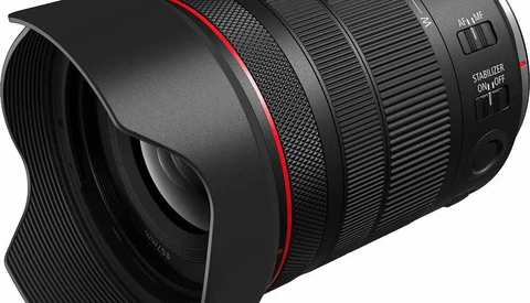 Canon RF-mount telephoto zoom lens with hood and red accent ring