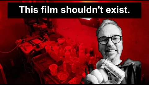 Graphic design with man in glasses against red background with text overlay