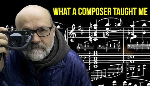 Man with camera holding sheet music, with text overlay reading 'WHAT A COMPOSER TAUGHT ME'