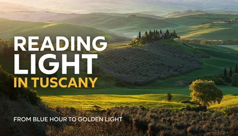 Rolling Tuscan hills at golden hour with cypress trees and a hilltop villa