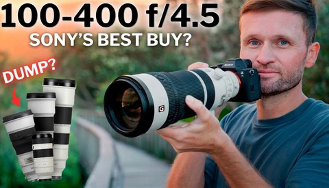 Photographer holding Sony 100-400mm f/4.5 lens with comparison of other Sony lenses displayed