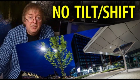 Photographer demonstrating nighttime architectural lighting technique with illuminated tree