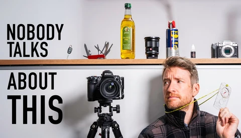 Photographer holding light meter next to camera on tripod with text overlay 'Nobody Talks About This'