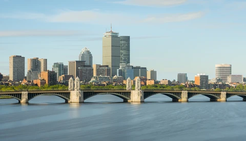 Boston skyline and Longfellow Bridge spanning the Charles River at golden hour