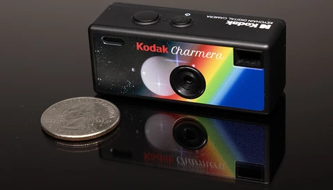 Kodak Charmera compact camera next to a US quarter for scale