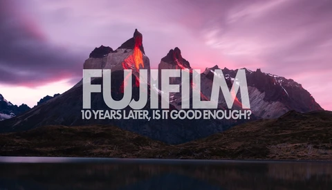 Graphic overlay with 'FUJIFILM' text and tagline on dramatic mountain landscape at sunset