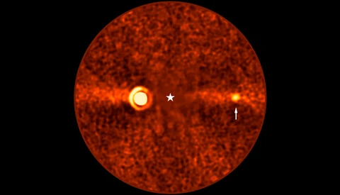 Thermal or infrared imaging illustration showing a circular red sphere with two bright hot spots and a central crosshair marker