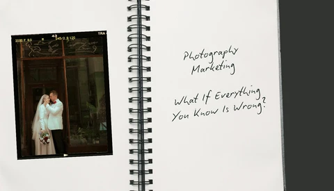 Open spiral notebook with handwritten text and vintage film photograph of a couple