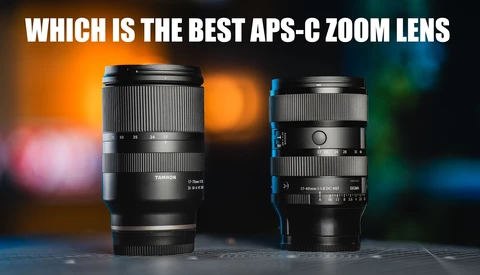 Comparison of two APS-C zoom lenses displayed against colorful bokeh background