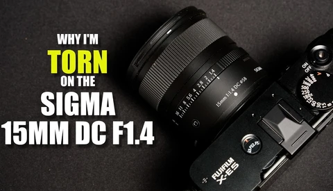 Sigma 15mm DC F1.4 lens mounted on camera with text overlay stating reasons for criticism