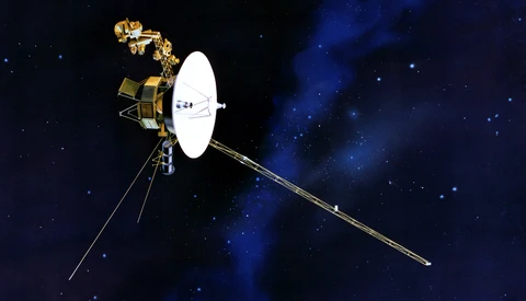Illustration of Voyager spacecraft with extended antenna against starfield background