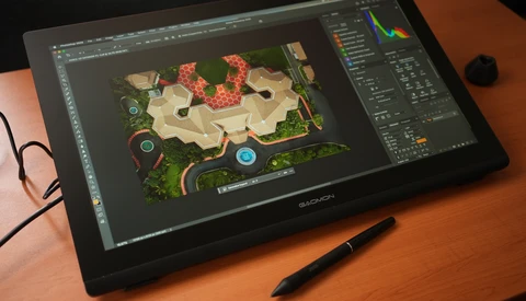 Wacom pen display showing aerial map design with red structures and interface panels